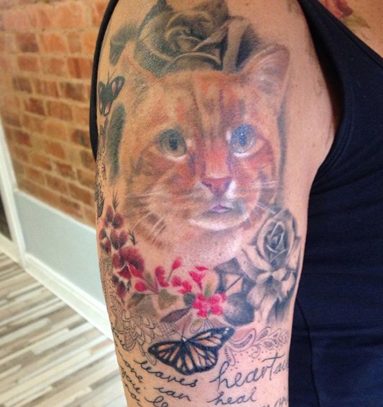 Minimalist Cat Memorial Tattoo with a Soft Heart Accent